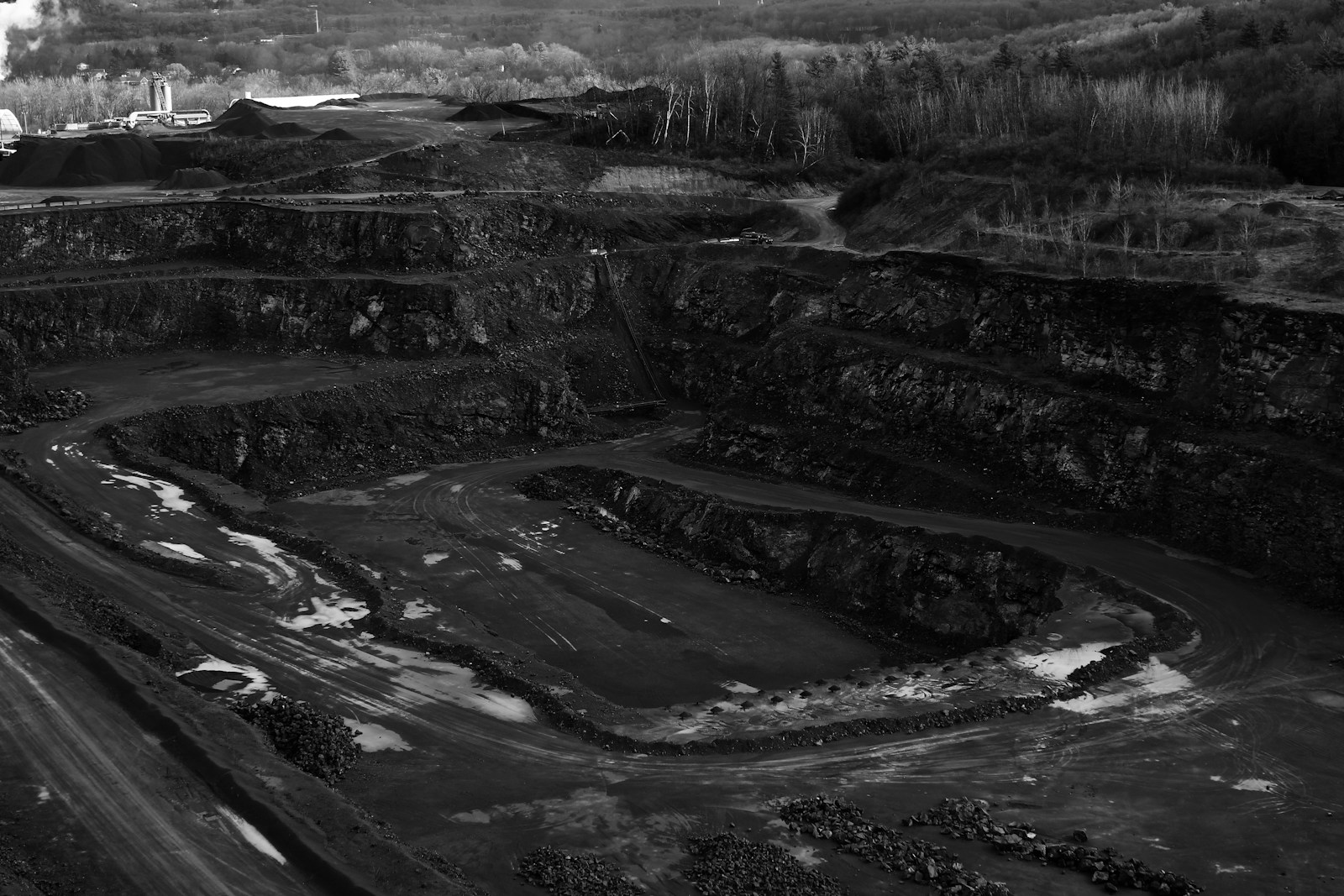 Terraced open-pit mine, illustrating the industrial context of Coal-chain